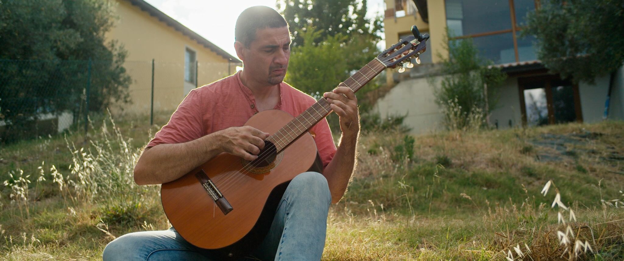 Simone Gubbiotti performing acoustic guitar — Perugia, Italy, July 2025