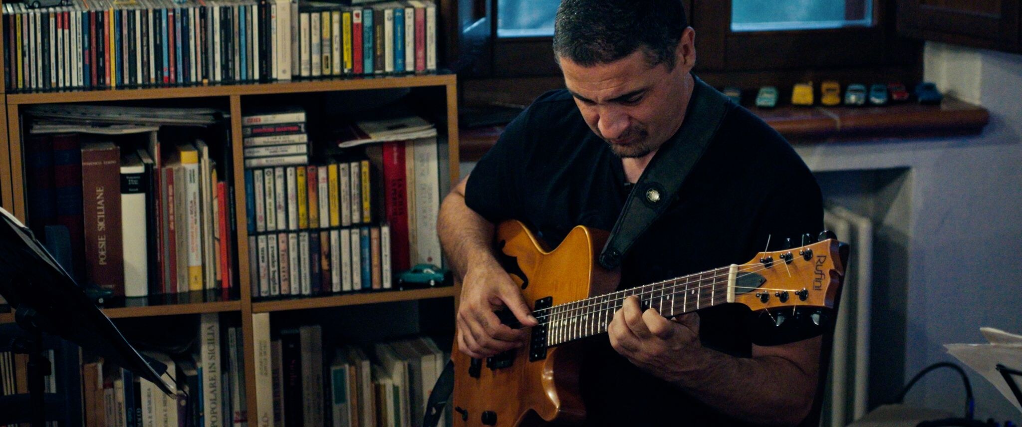 Simone Gubbiotti performing electric guitar — Perugia, Italy, July 2025